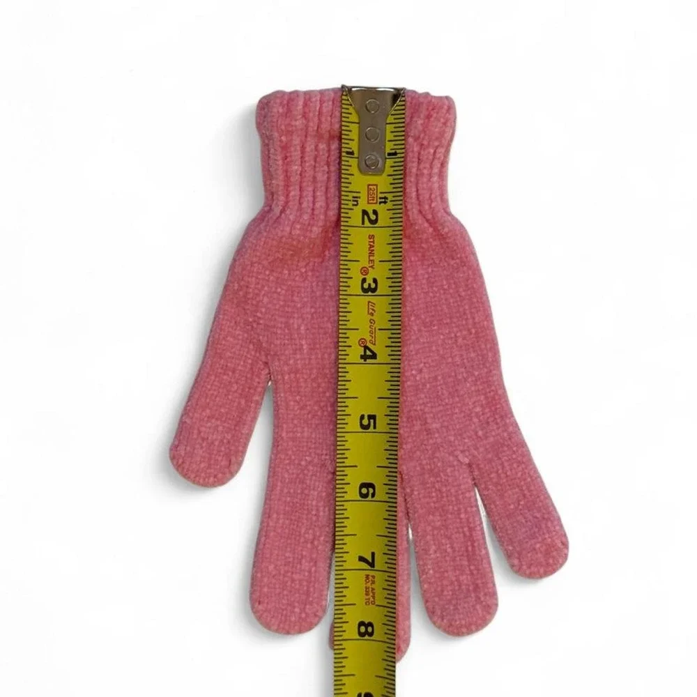 Pink knitted gloves with subtle speckled texture